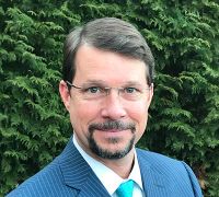 Middle-aged guy in glasses with a goatee